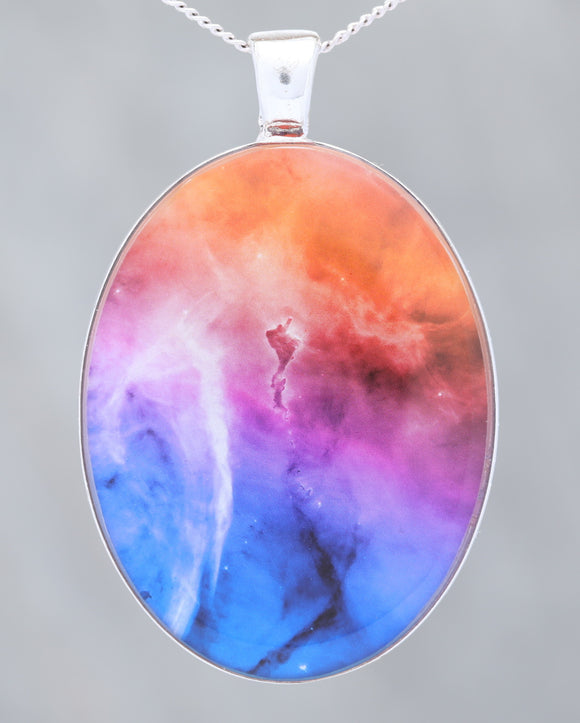 Glow-in-the-dark astronomy pendant with a beautiful astrophotography image of the Carina nebula