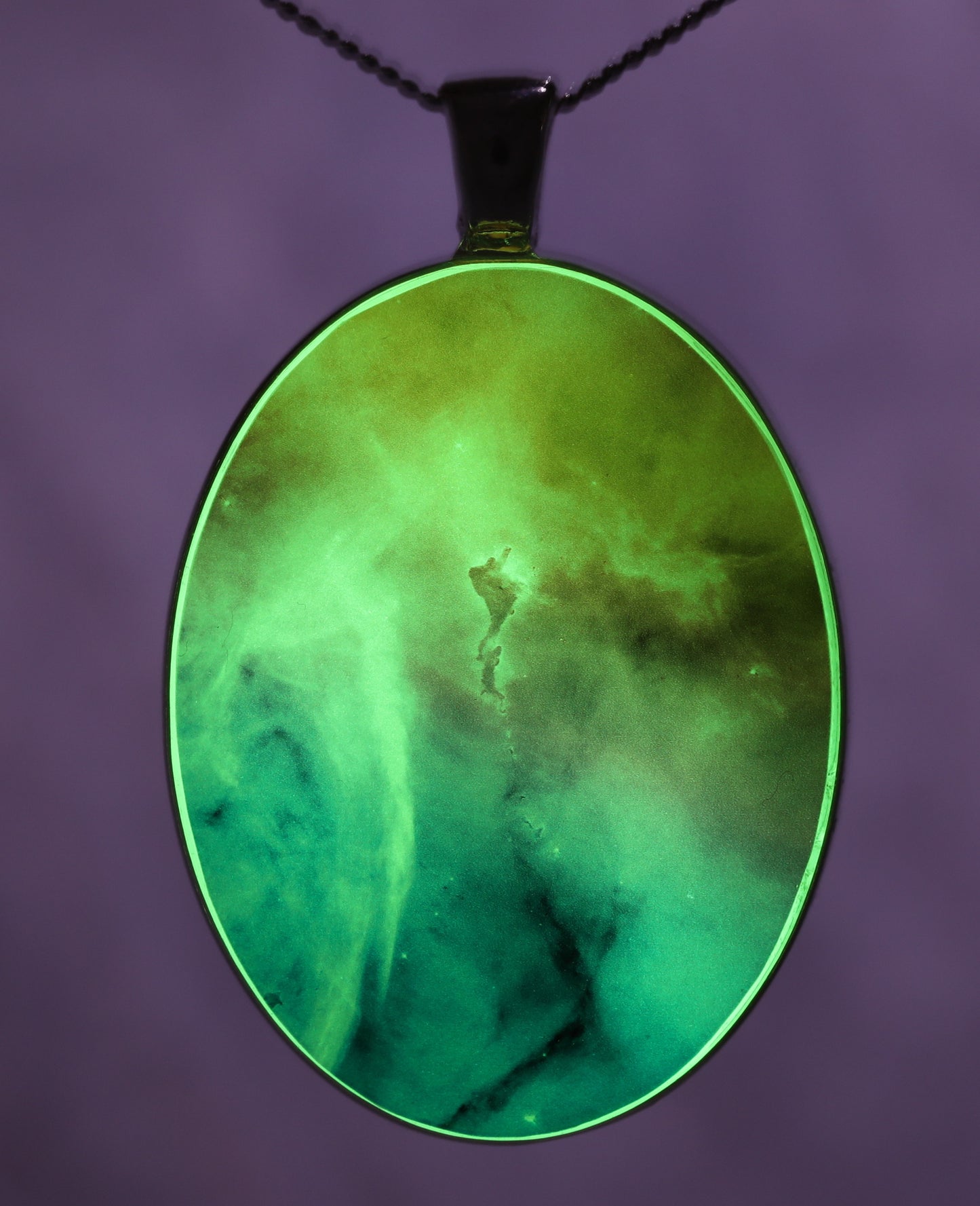 Glow-in-the-dark astronomy pendant with a beautiful astrophotography image of the Carina nebula