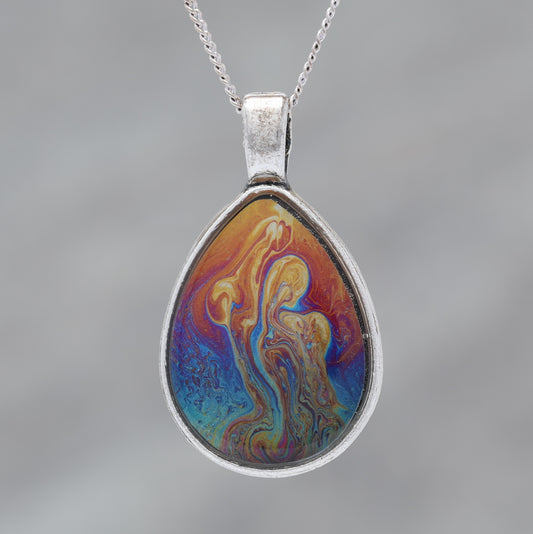 Rainbow Power! Glow-in-the-dark pendant with a beautiful abstract soap film pattern