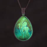 Rainbow Power! Glow-in-the-dark pendant with a beautiful abstract soap film pattern