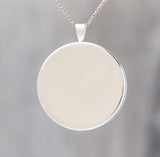 Hanging On - Glow-in-the-dark pendant with a surreal image of trees