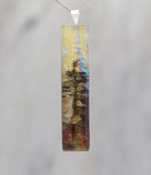 Hanging On - Glow-in-the-dark pendant with a surreal image of trees