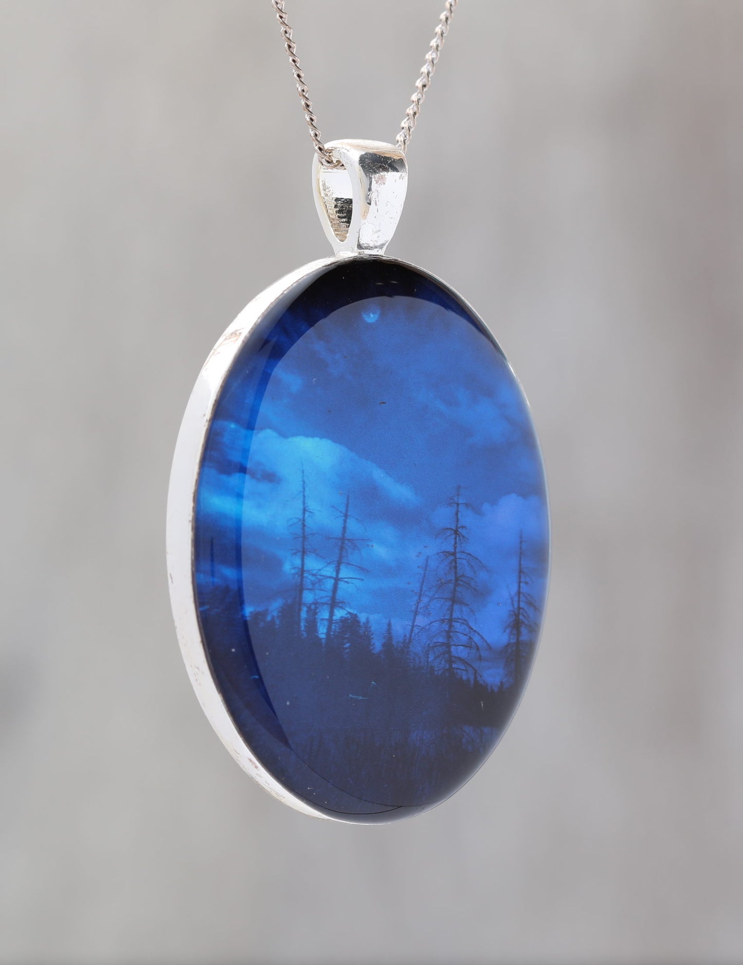 Blue Sky At Night  - Glow-in-the-dark pendant with the Orion Nebula