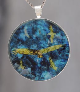 Flying by the Seaside  - Glow-in-the-dark pendant with a beautiful abstract bird pattern