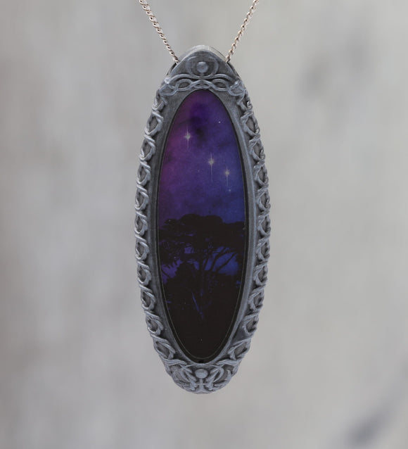 Trees Dreaming - Galaxy Pendant with Celtic Knotwork  and made with a photo of a tree and the Carina Nebula!