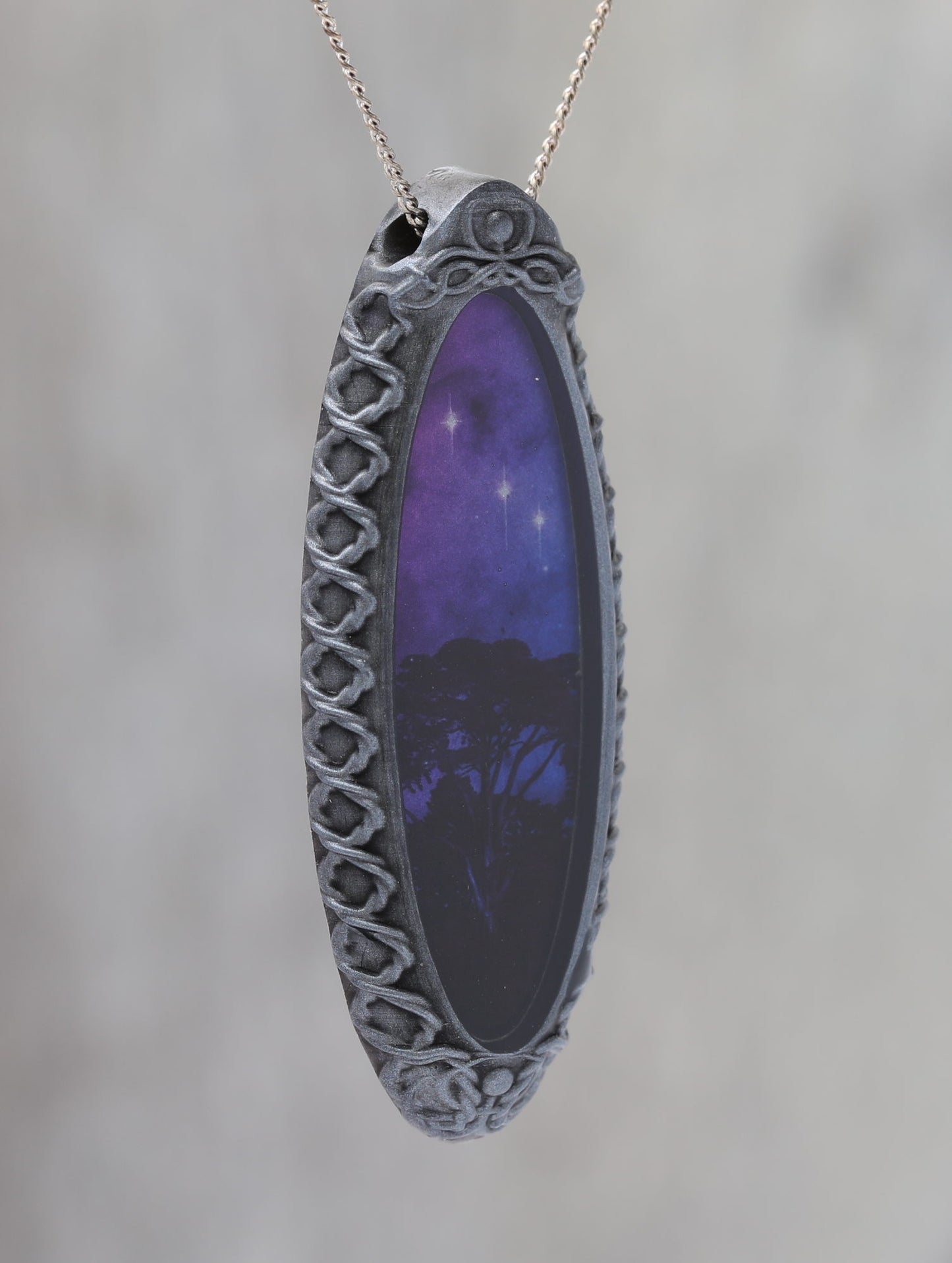 Trees Dreaming - Galaxy Pendant with Celtic Knotwork  and made with a photo of a tree and the Carina Nebula!